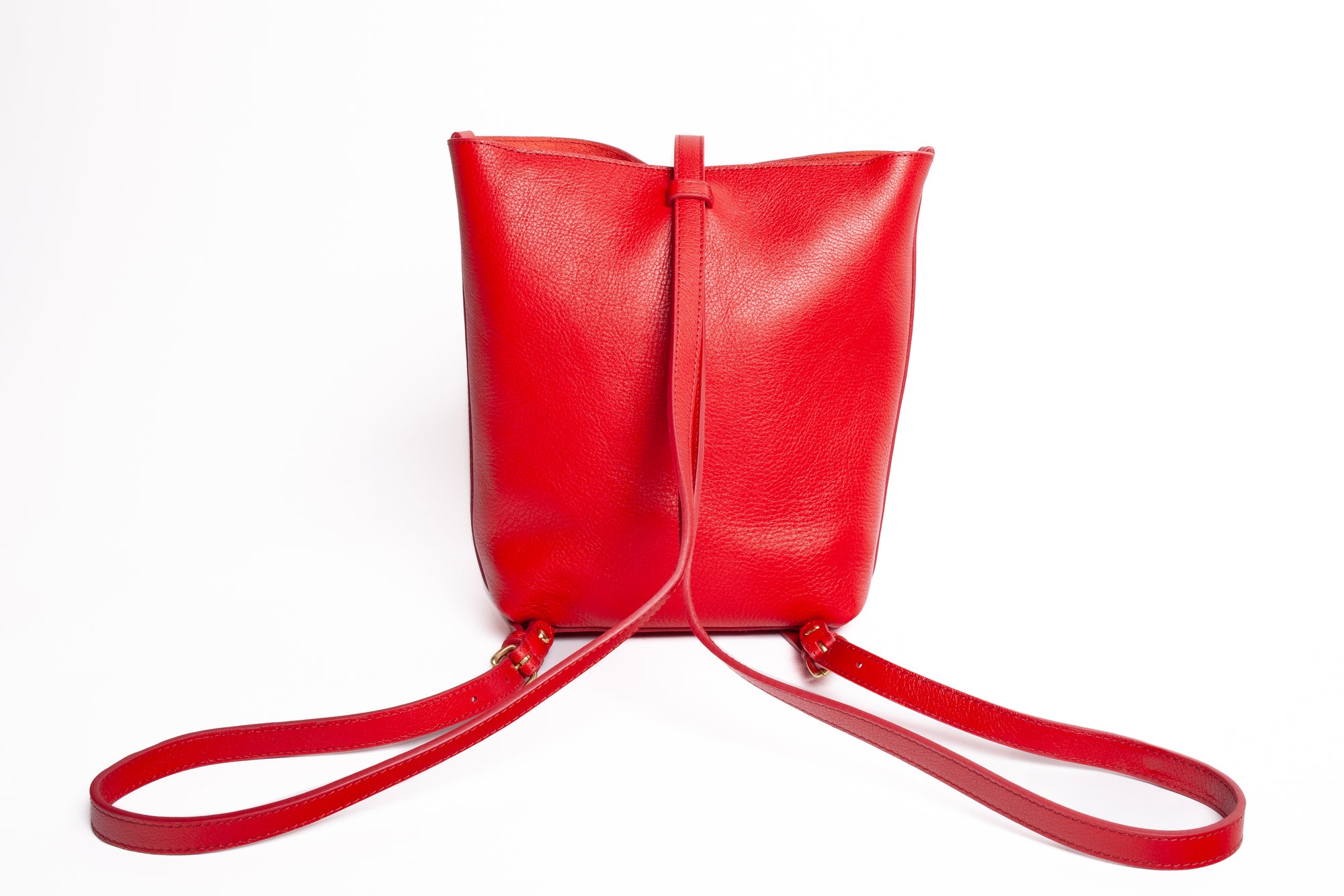 The Mini Sling Backpack Pop Red