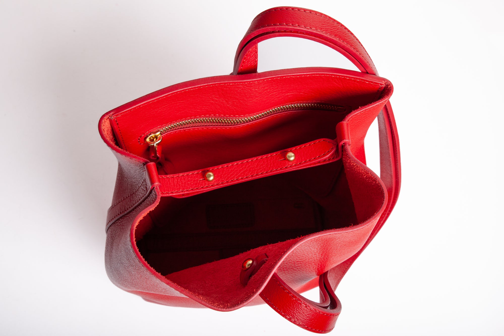 The Mini Sling Backpack Pop Red