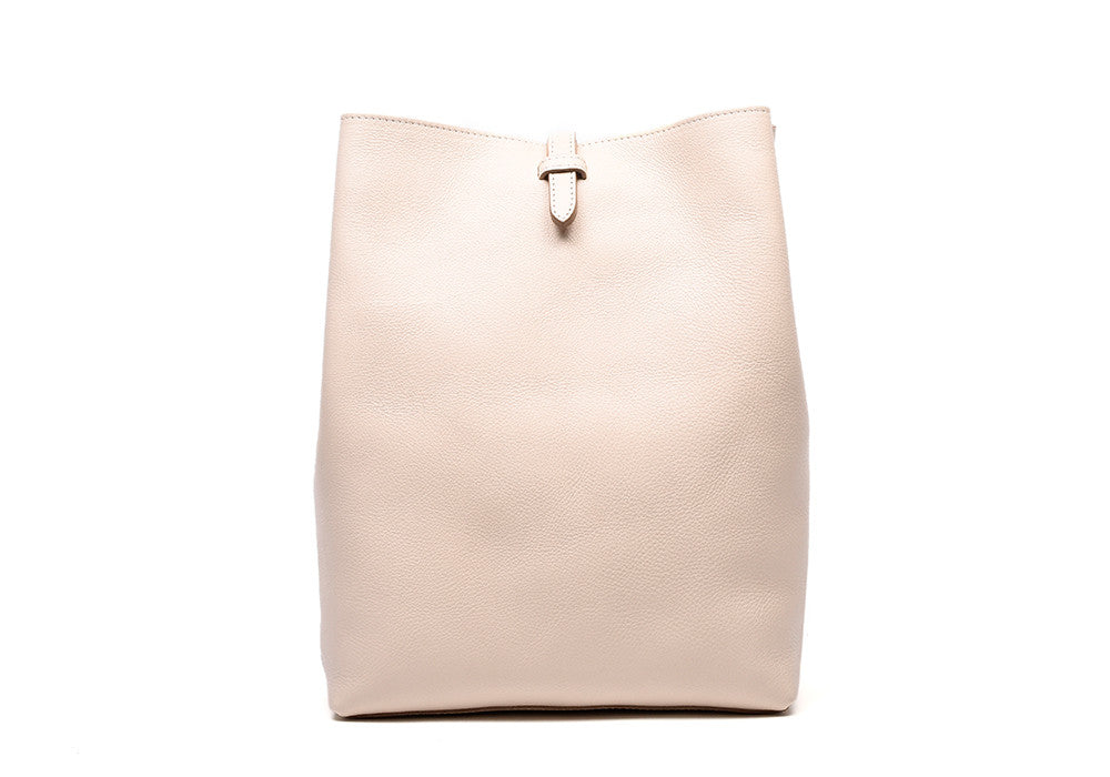 Front Leather View of The Sling Backpack Natural