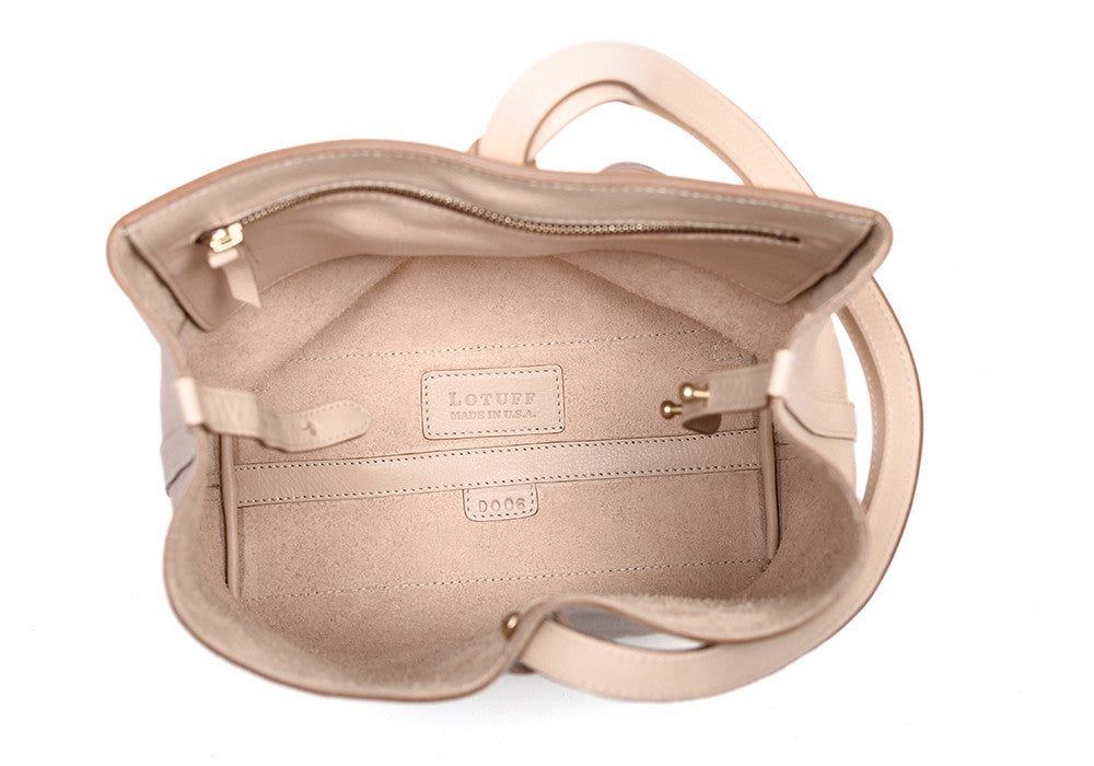 Inner Leather Pocket of The Sling Backpack Natural